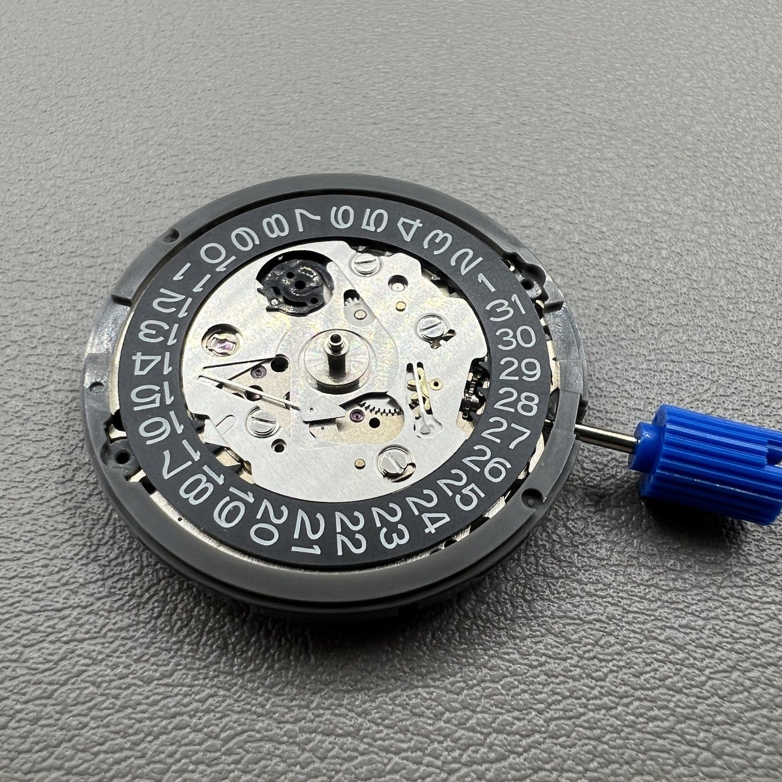 Japan NH35 automatic chronograph watch dial in black with date window and crown at 3 o?clock.