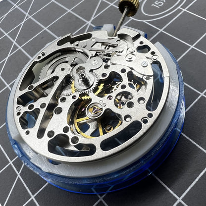 Dandong Silver Hollow watch accessory displaying intricate automatic mechanical movement with second stop function.