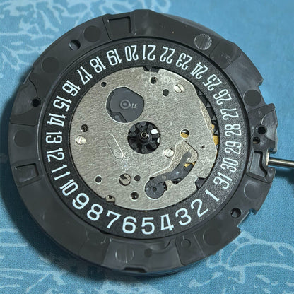 Japan Made Miyota OS21 quartz watch movement featuring a black disk wheel with zero jewels for precise timekeeping.