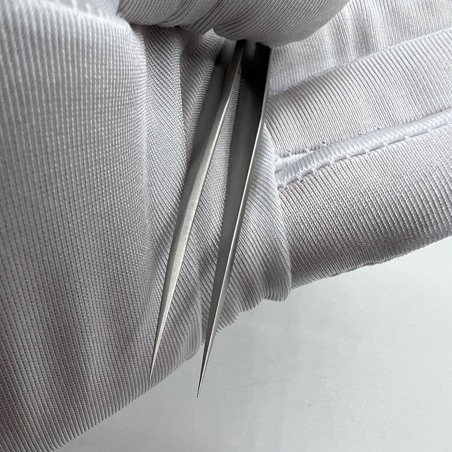 Swiss Bergeon 7026-3 antimagnetic fine hairspring tweezers for precise watch repair tasks.