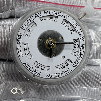 Mechanical watch with double calendar, date at 3 o'clock, day at 12, in watch accessories.