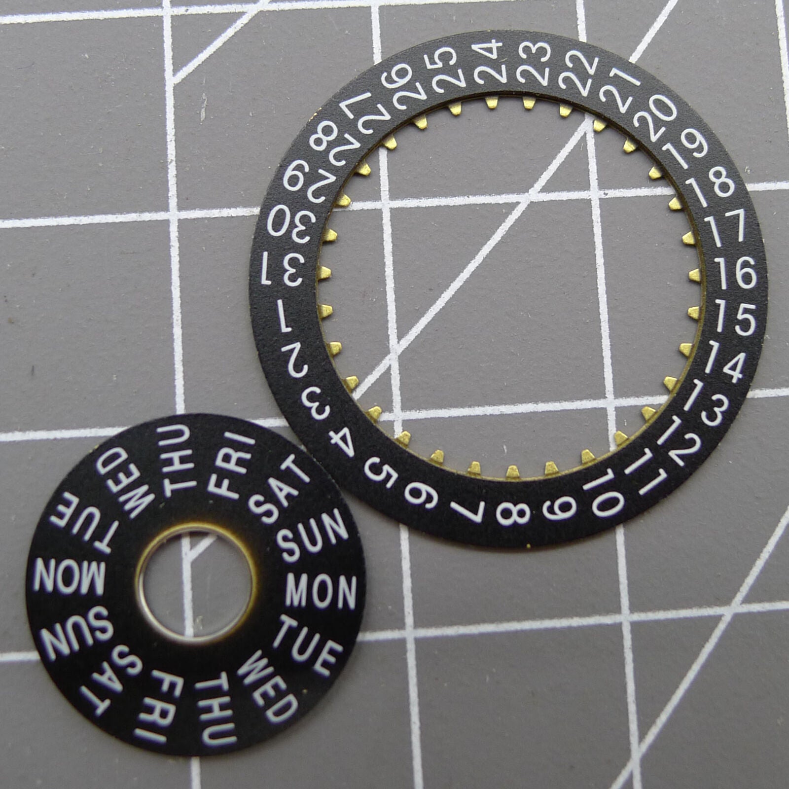 Pilot black date disk wheel and week wheel for China Made Dandong 7750 watch movement, perfect for repairs and customization.