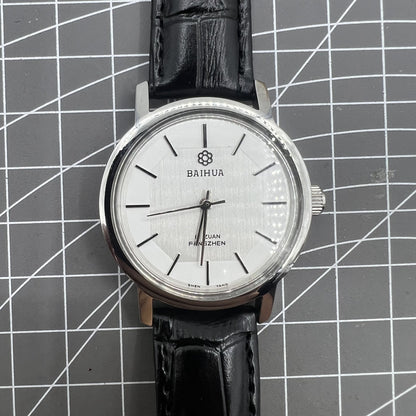 Baihua 37mm manual mechanical watch, silver dial, 19 jewels, shock-resistant for lasting durability.