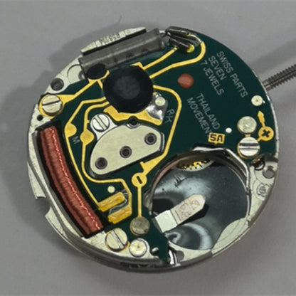 ETA 956.114 quartz watch movement with white dial, three-hand design by ETA for accurate timekeeping.