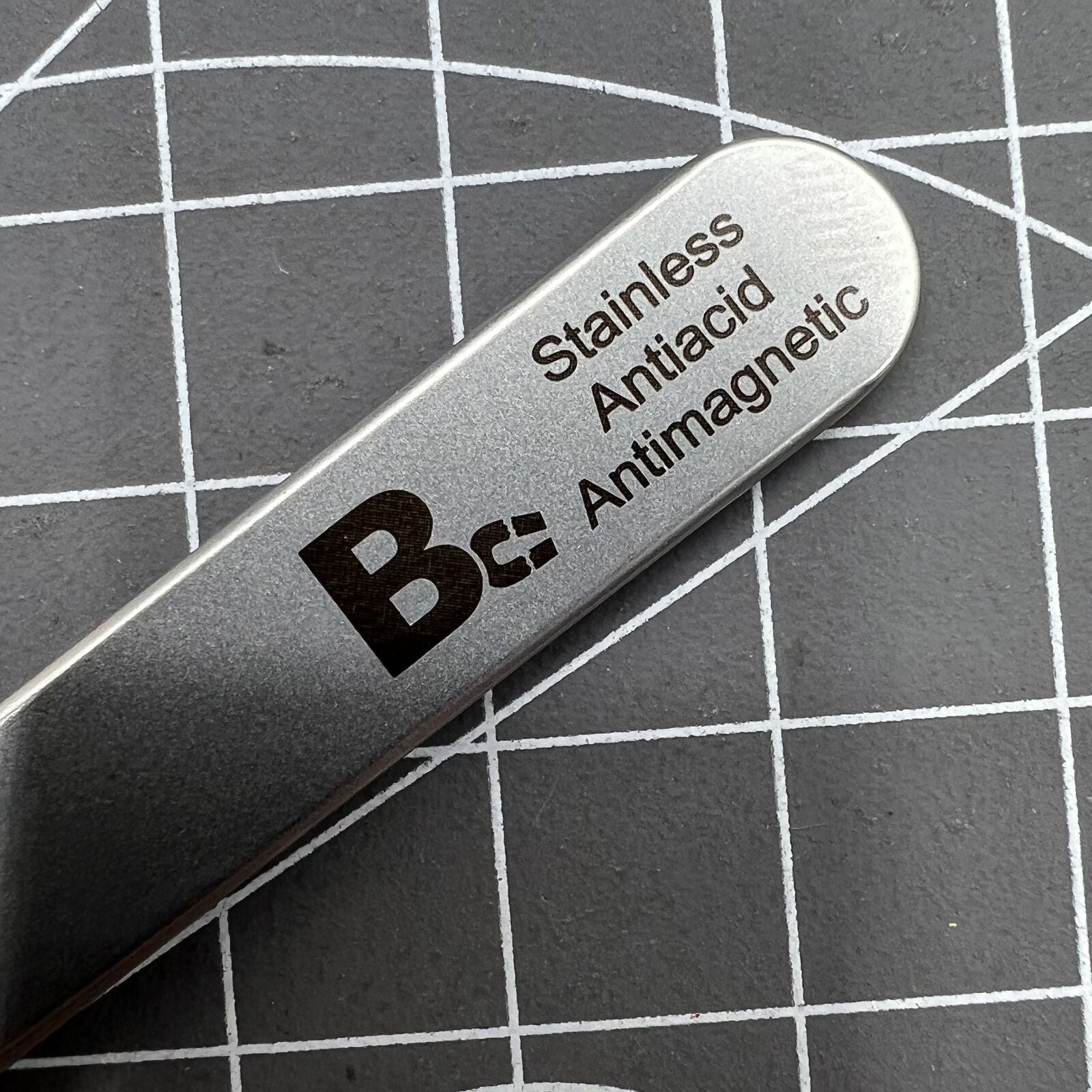 Bergeon 7026-3 antimagnetic tweezer for precise hairspring handling in watch repair tools.