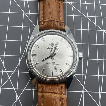 32mm Chunlan manual watch with silver dial, 17-jewel movement, classic mechanical design.
