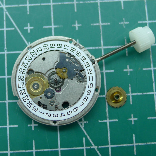 Wholesale ETA 956.114 quartz movement with white dial and 3-hand display for watch repair and replacement.