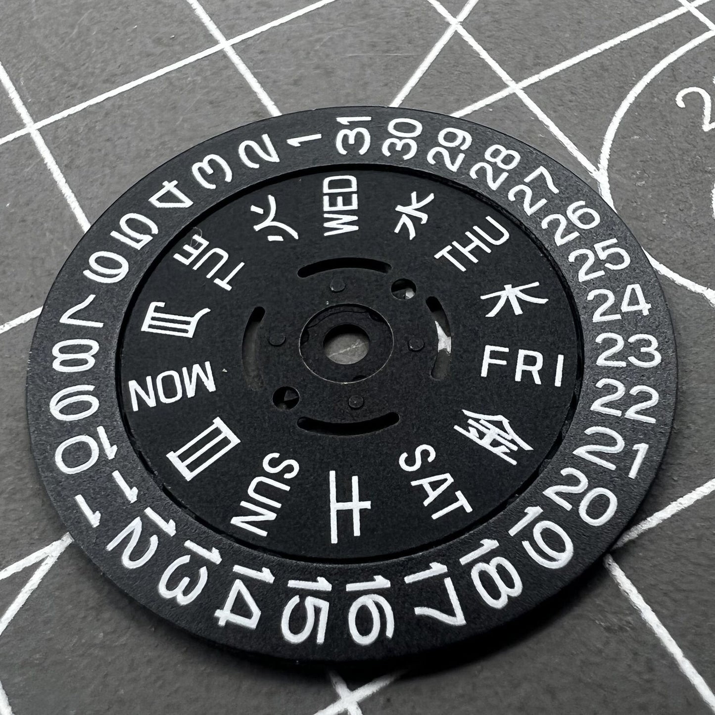 Green lume date and week wheels for NH36 movement, showing date at 3.8, precision watch accessory.