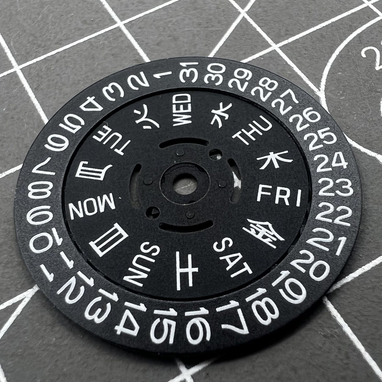 Green lume date and week wheels for NH36 movement, showing date at 3.8, precision watch accessory.