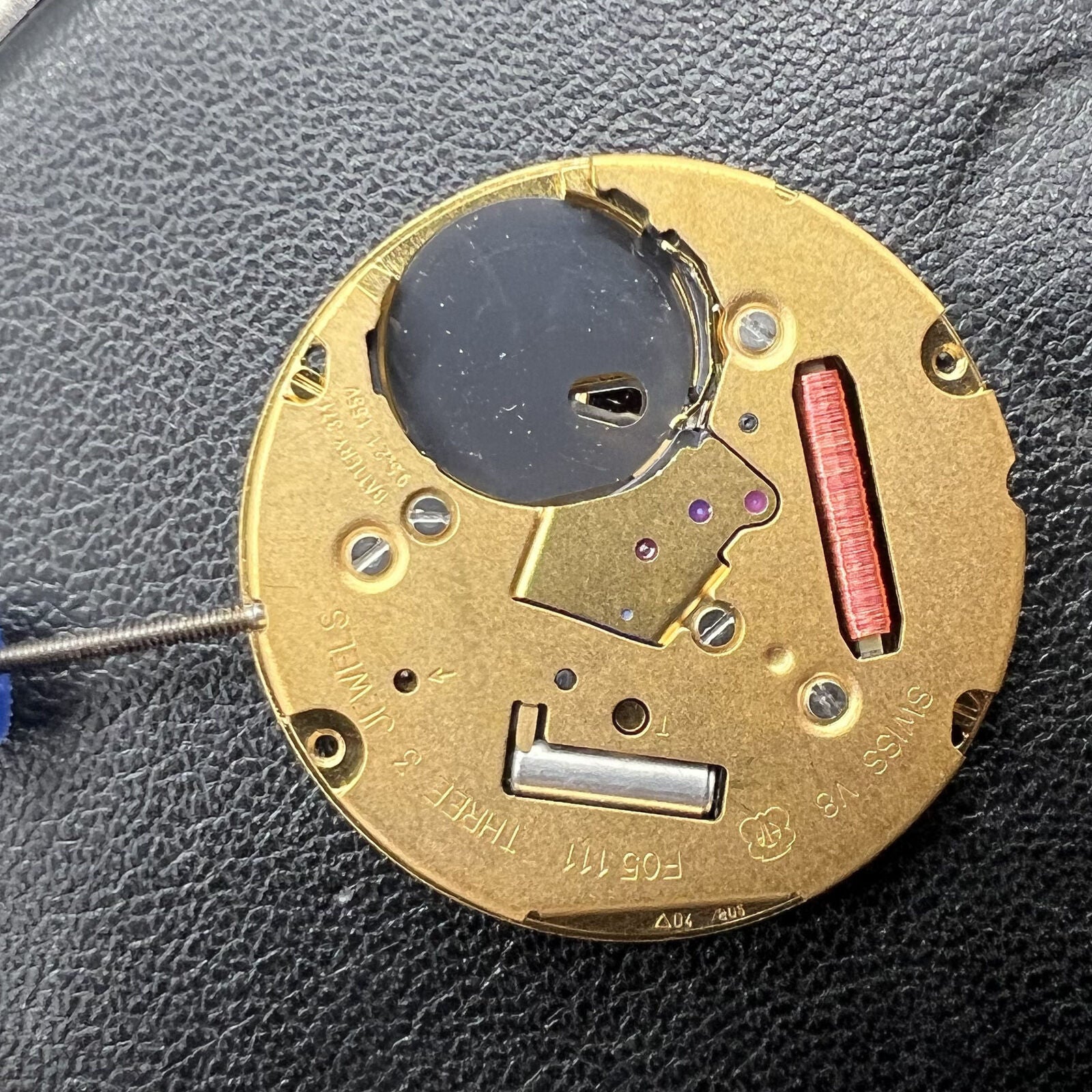 ETA F05.111 quartz watch by ETA with 2 hands, date at 6, precise movement, and sleek design.