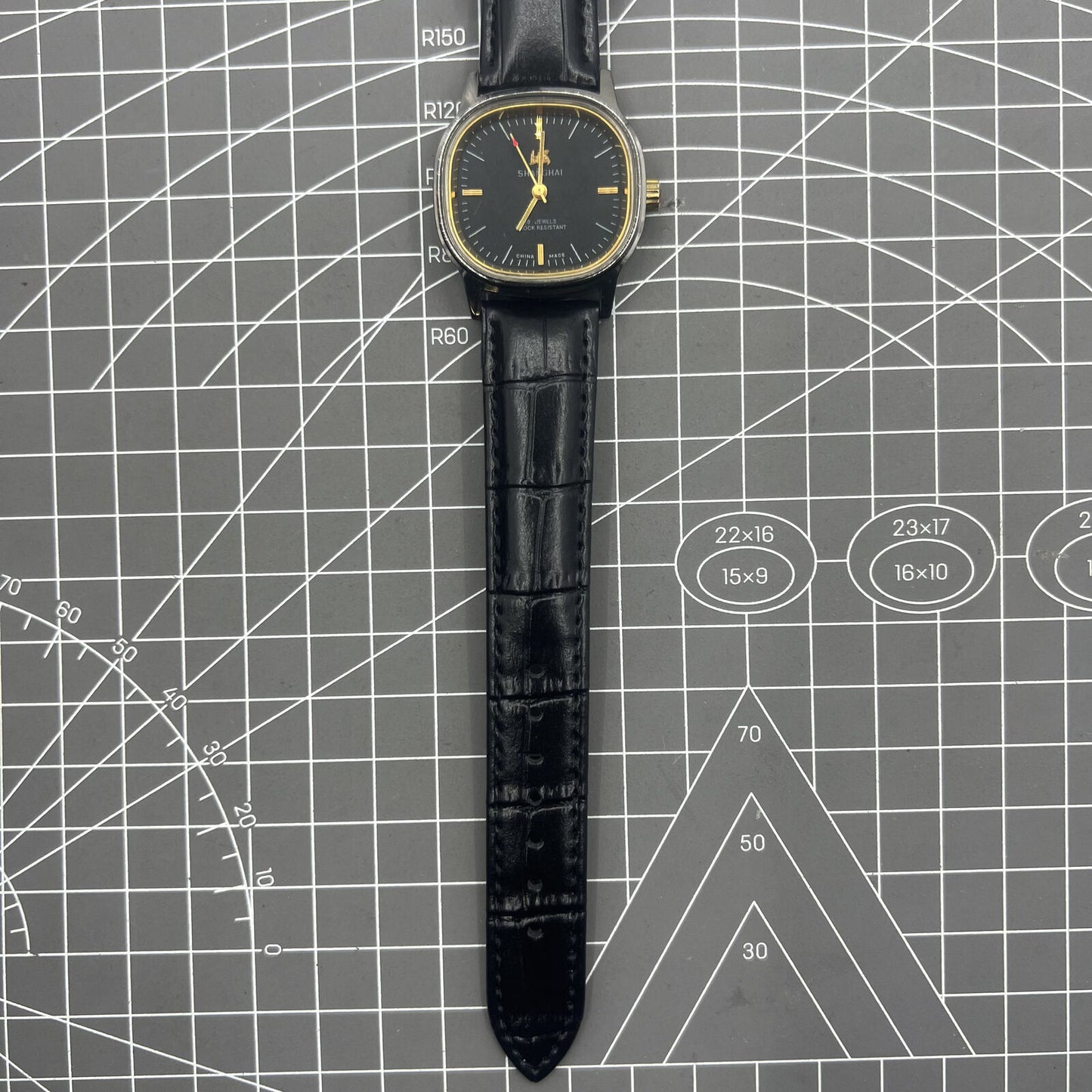 Shanghai Factory 34mm manual mechanical watch with black dial, 19 jewels, shock-resistant for daily wear.