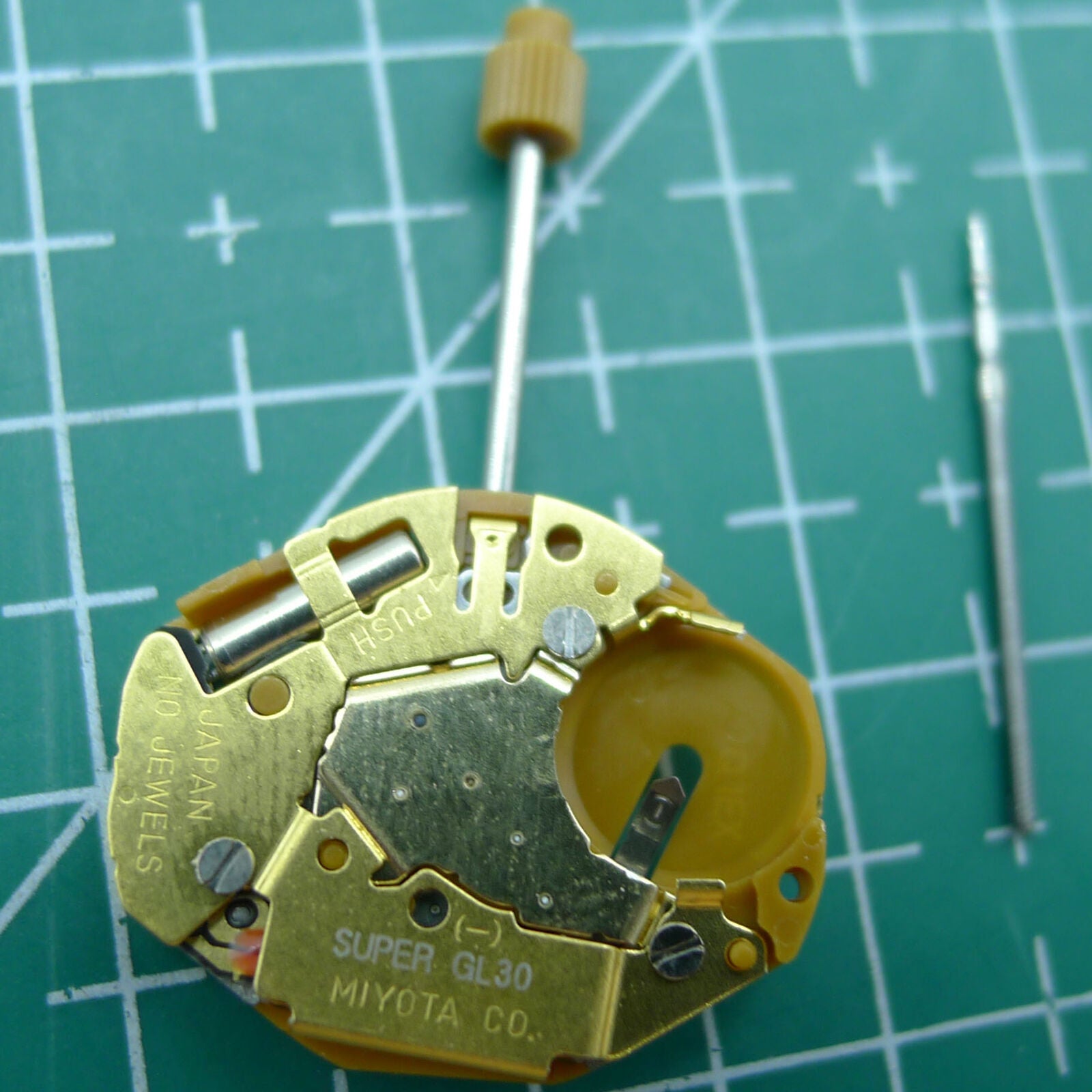 Miyota GL30 quartz watch movement with three gold hands, Japan-made precision timekeeping by Miyota