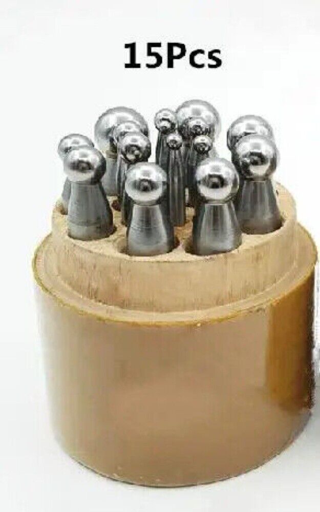 Shaping dapping punch set on wooden stand, perfect for jewelers crafting intricate designs.