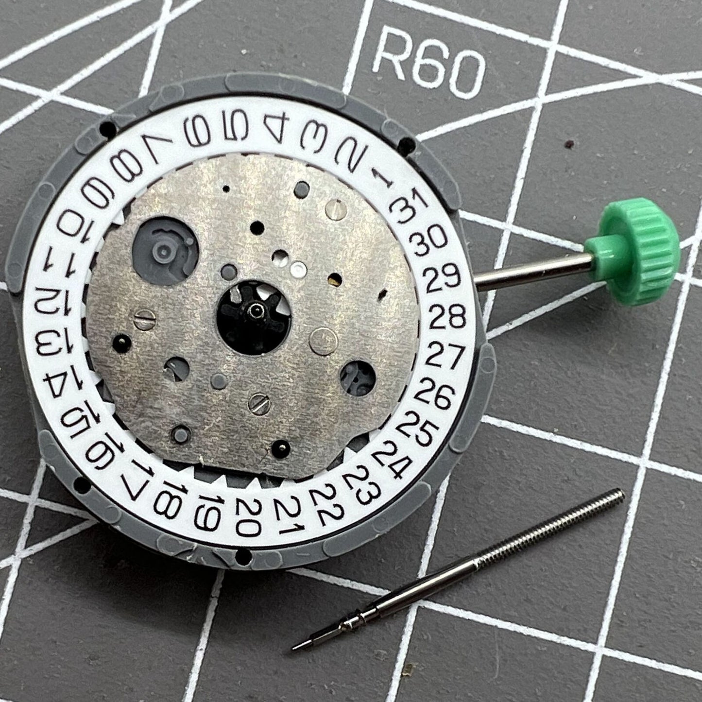 Miyota FS20 chronograph watch movement with date window at 3 o'clock, Japan quartz precision.