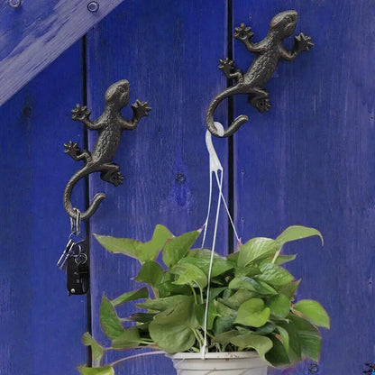 Vintage cast iron gecko wall hook, rustic design for hanging clothes or garden tools.