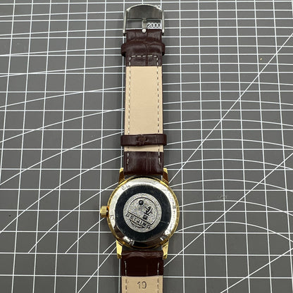 Beijing Double Rhomb mechanical watch with golden case, silver nail markers, and elegant classic design