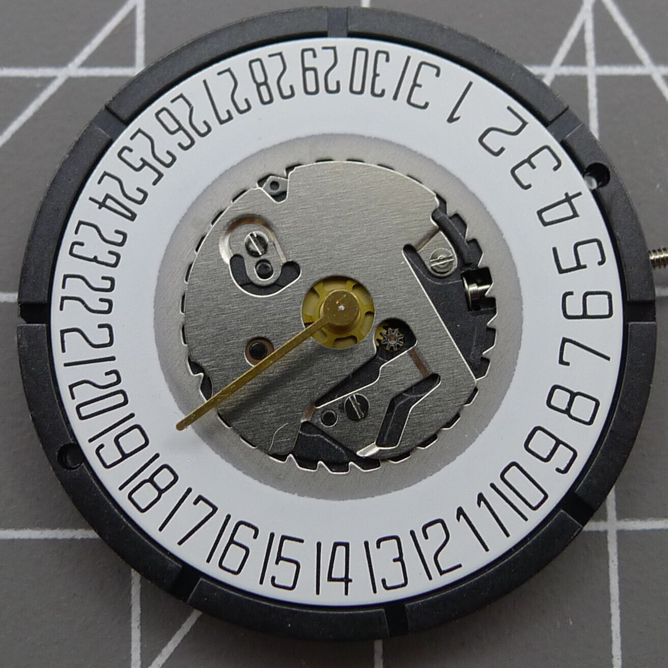 Swiss ISA 2331 watch part with black dial, quartz movement, and date display at 6 o'clock for precise timekeeping.