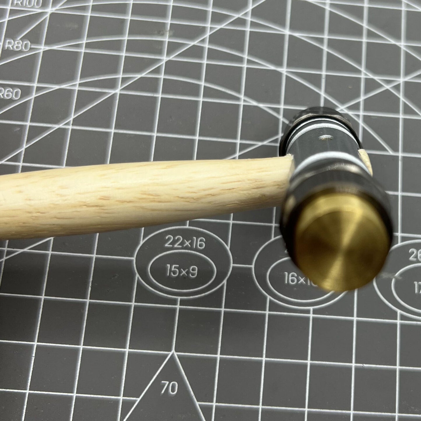 Swiss Bergeon 30417 hammer with brass and synthetic ends for precise, delicate watch repair tasks.