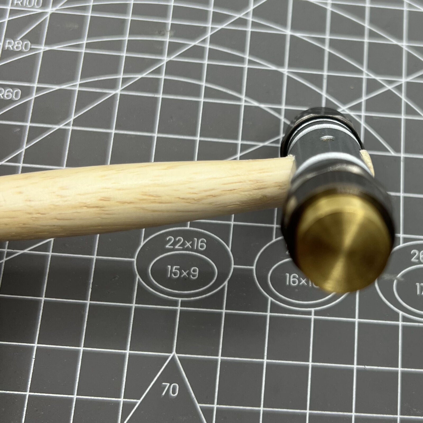 Swiss Bergeon 30417 hammer with brass and synthetic ends for precise, delicate watch repair tasks.