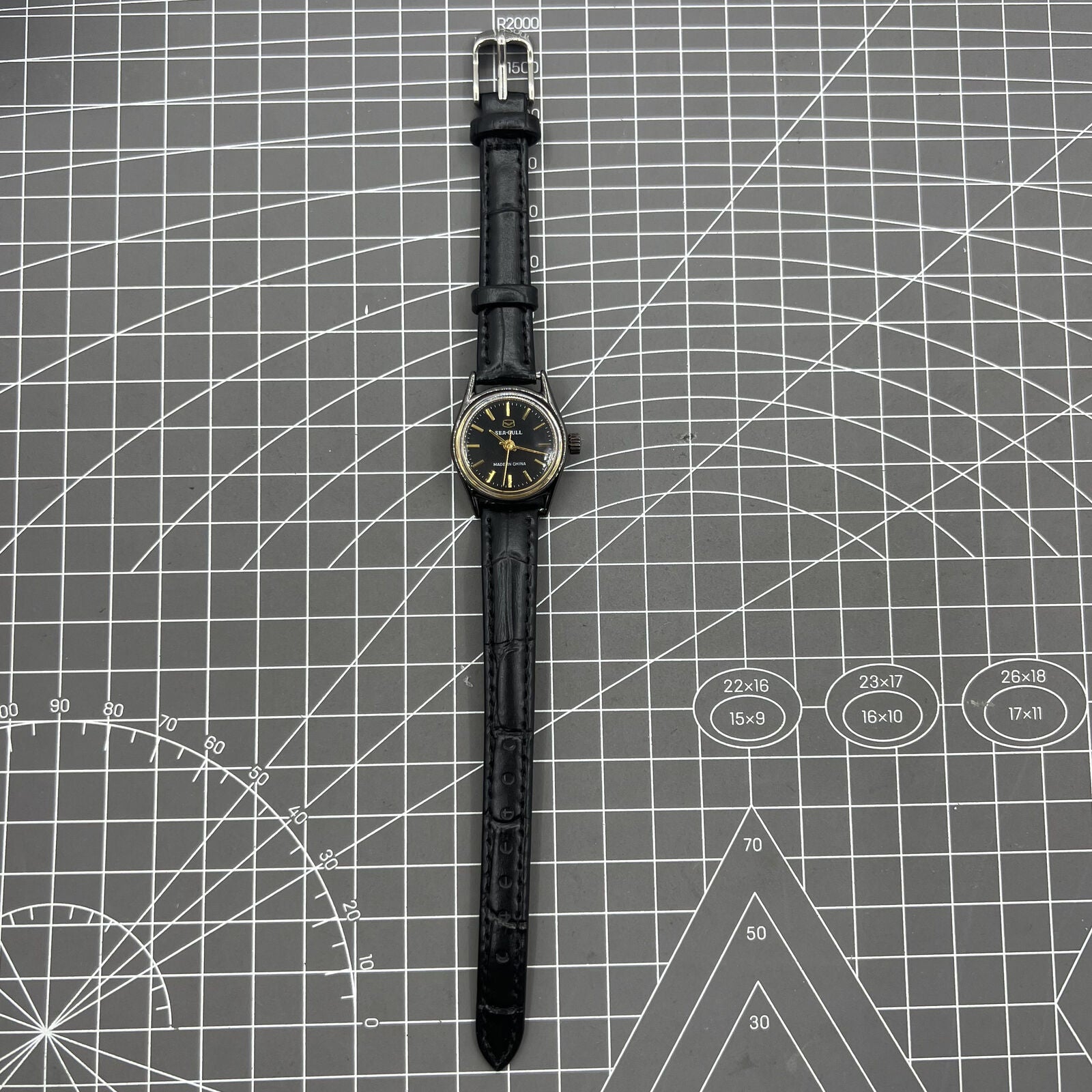 27mm Tianjin Seagull ladies watch with manual mechanical movement and golden nail hour markers.