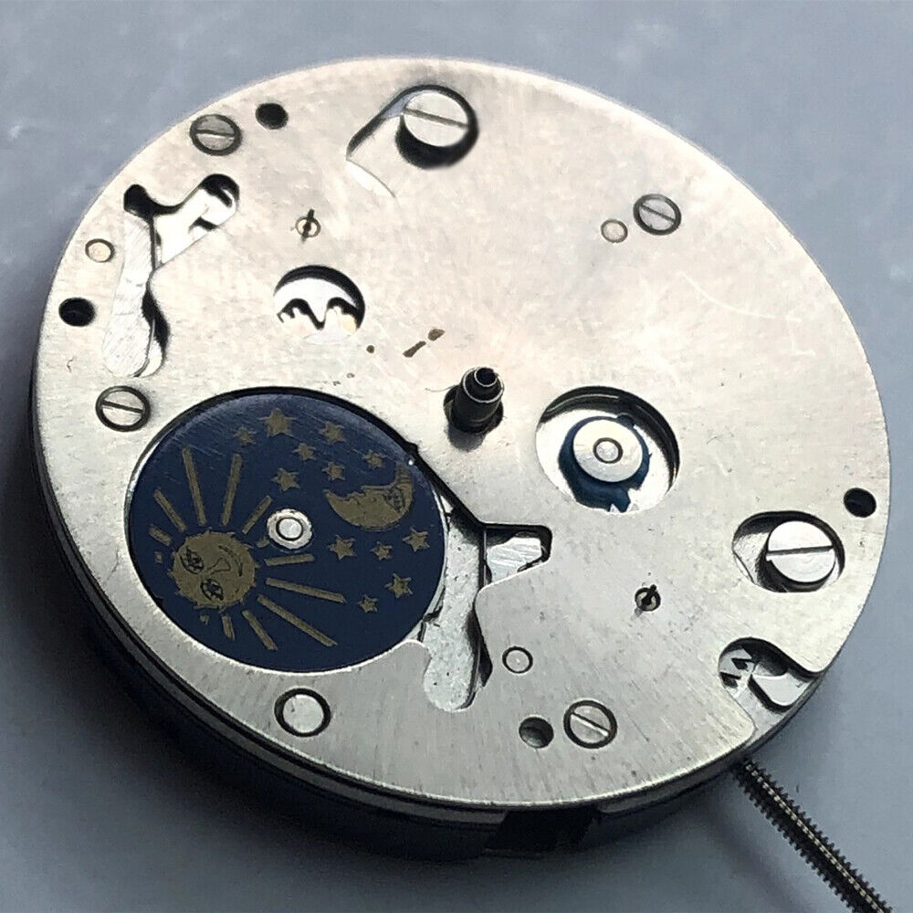 Swiss Made ISA 9231 quartz movement watch part with star moon phase at 6 for precise timekeeping.