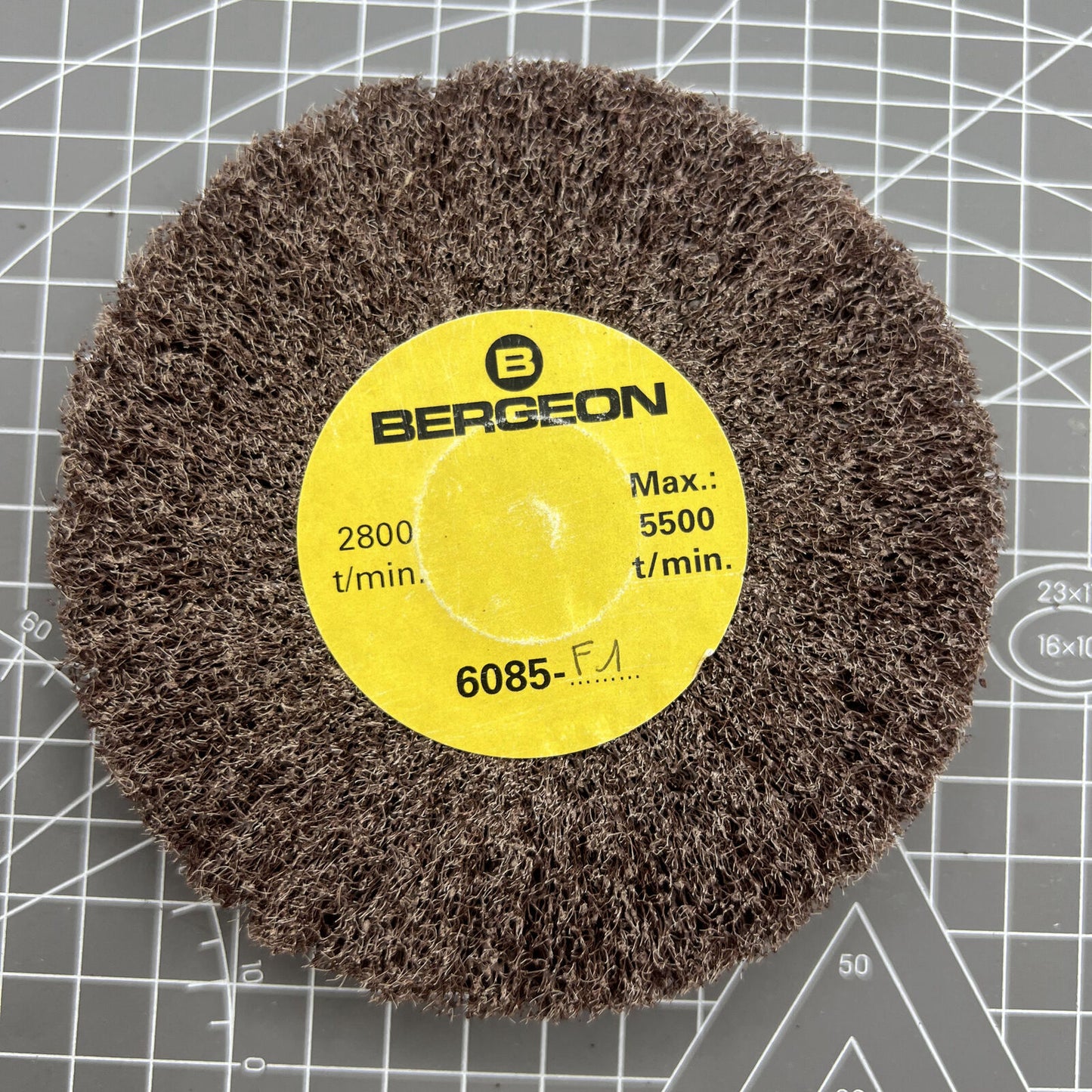 Bergeon 6085-F1 polishing brush with medium grain aluminum oxide wheels for watch accessory finishing.
