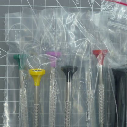 Swiss Bergeon 7778 watch screwdriver set with 6 precision blades and organizer stand for watch repair tasks.