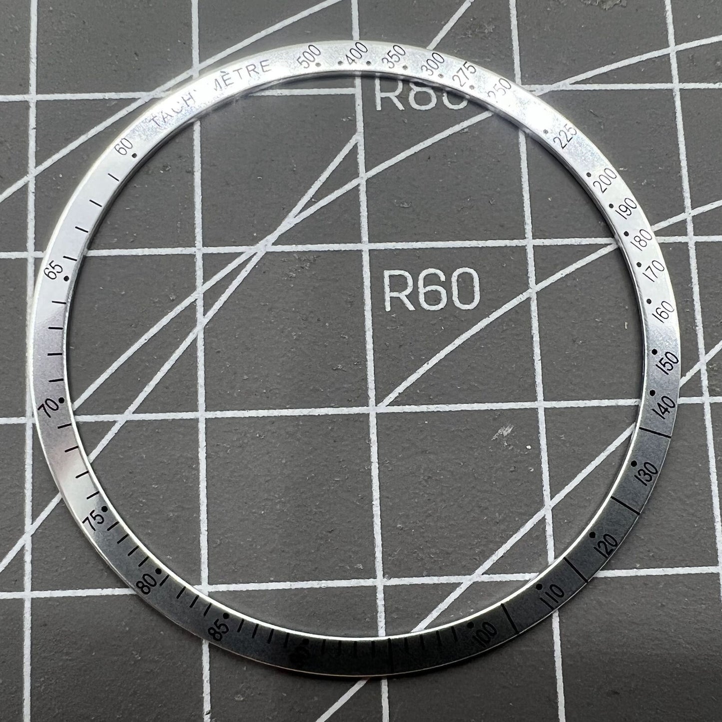38.5mm Omega Speedmaster aluminum alloy white ring bezel with black font detail for watch customization.