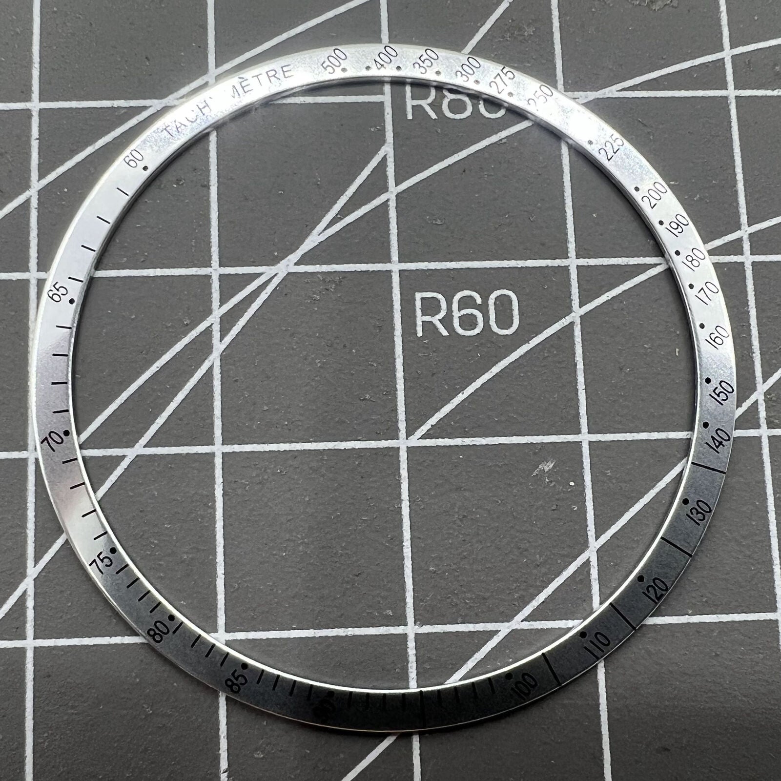38.5mm Omega Speedmaster aluminum alloy white ring bezel with black font detail for watch customization.