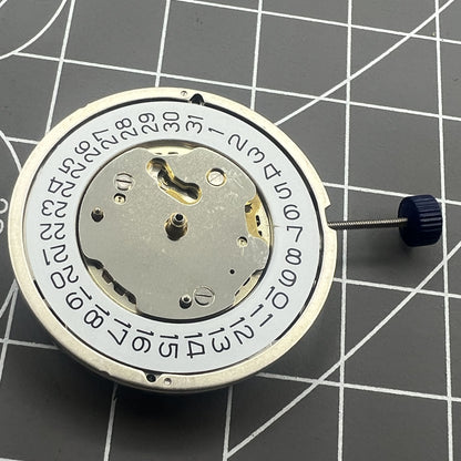 Close-up of Swiss Ronda 5130D quartz watch movement with Swiss parts for precise timekeeping.