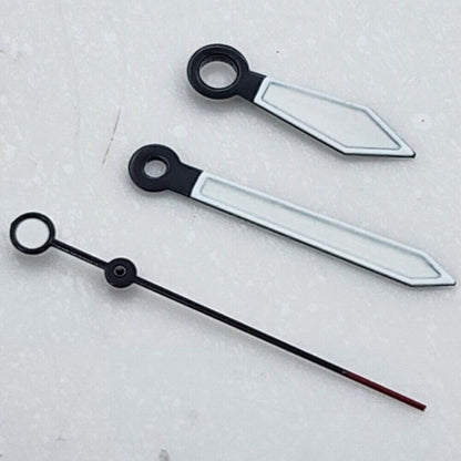 Black+White arrow-shaped watch hands with green lume for NH35 NH36 movement, enhancing visibility and style.