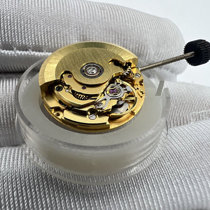 Golden ETA2671 mechanical watch movement with date display at 3 o'clock for precise replacements.