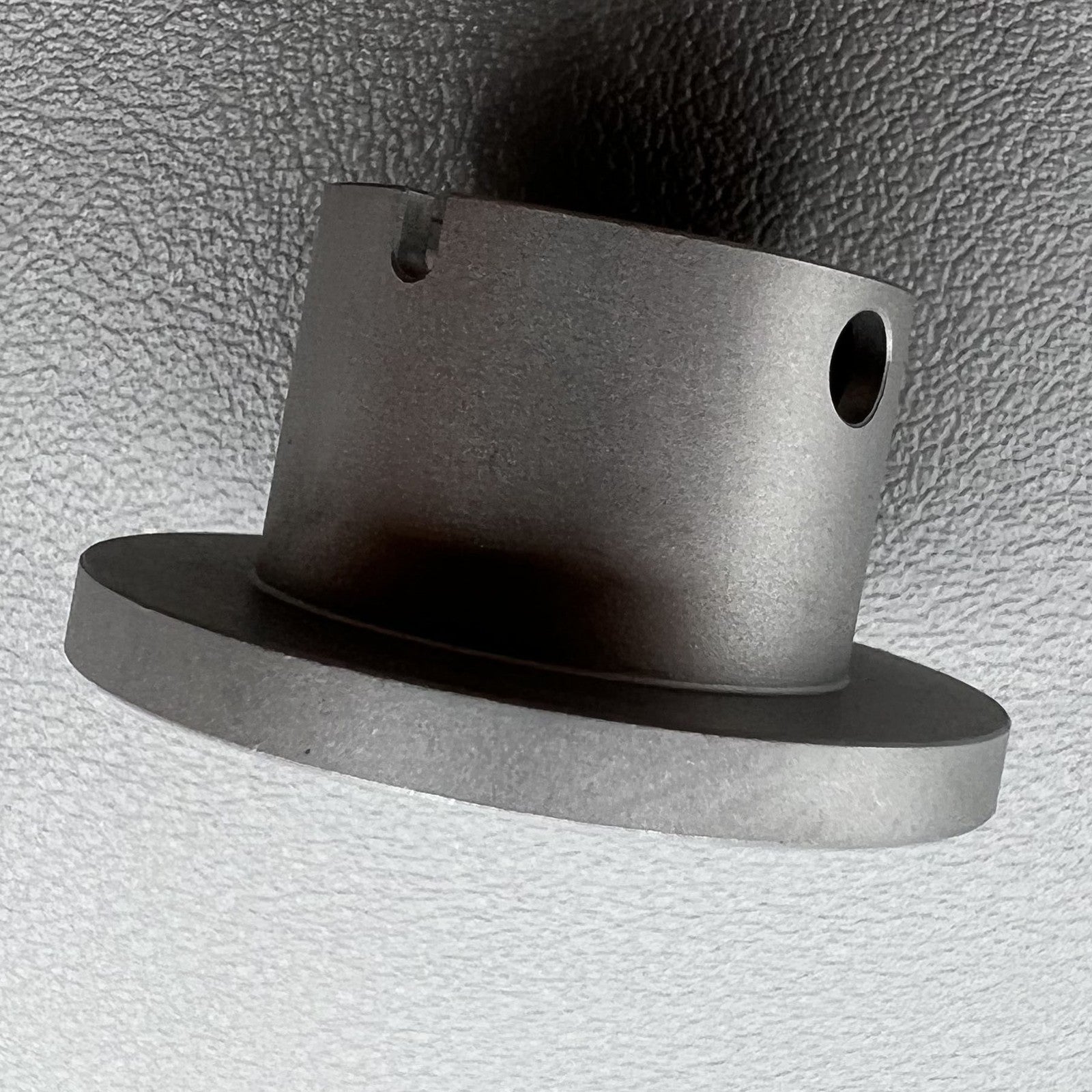 Size 7-3/4 ligne ETA 2671 movement holder with center screw for secure watch repair.