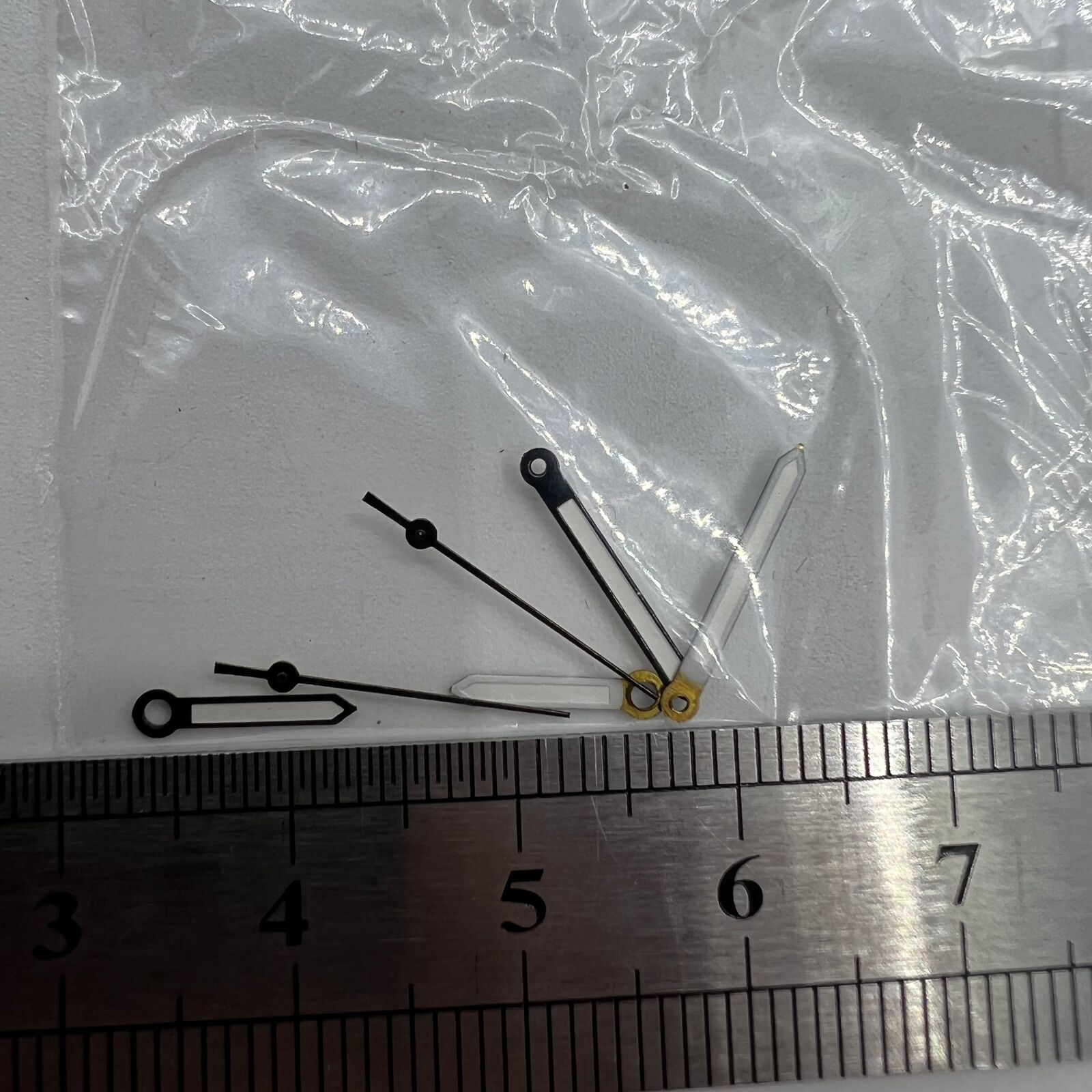 Luminous black watch hands compatible with Miyota 2035 quartz movement, enhancing visibility and style.