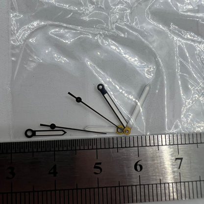 Luminous black watch hands compatible with Miyota 2035 quartz movement, enhancing visibility and style.