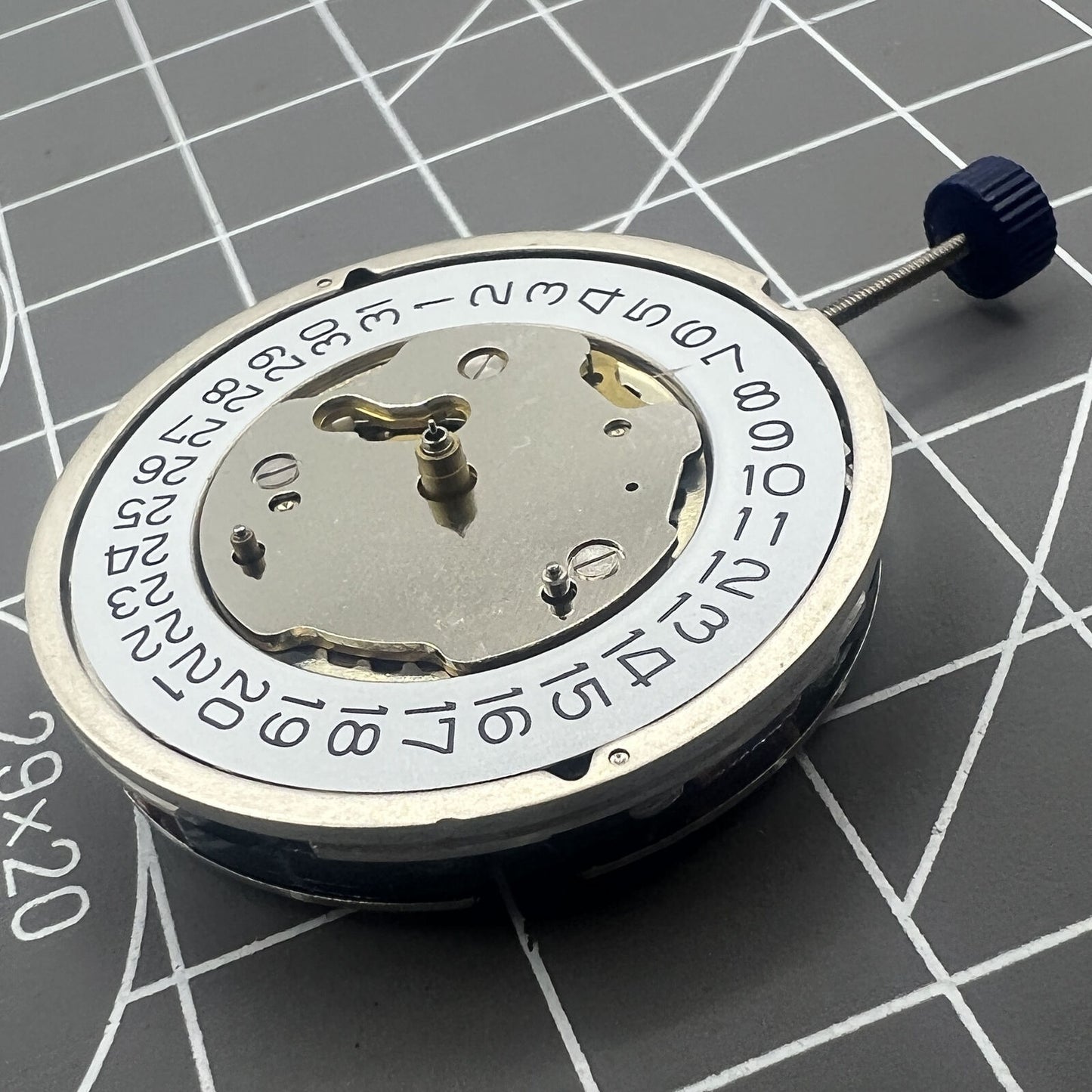 Close-up of Swiss Ronda 5130D quartz watch movement with Swiss parts for precise timekeeping.