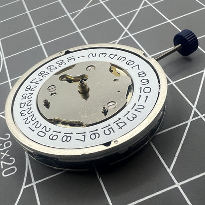 Close-up of Swiss Ronda 5130D quartz watch movement with Swiss parts for precise timekeeping.