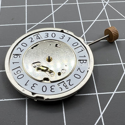 Swiss Made Ronda 6003B quartz watch movement with date display at 12 o'clock for precise timekeeping.