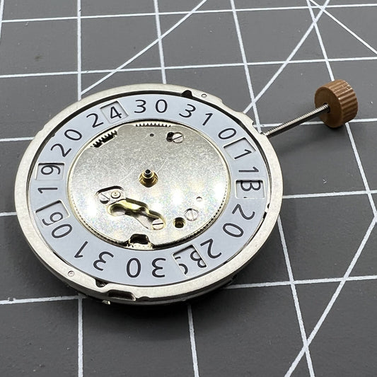 Swiss Made Ronda 6003B quartz watch movement with date display at 12 o'clock for precise timekeeping.