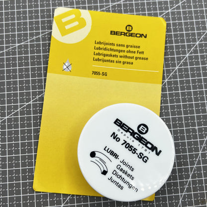 Swiss Bergeon 7055-SG watch lubricant seals box with two silicone grease foam pads for accessories.