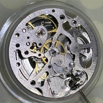 Silver 7120 hollow automatic watch part with mechanical movement and 3 hands for precision timekeeping.