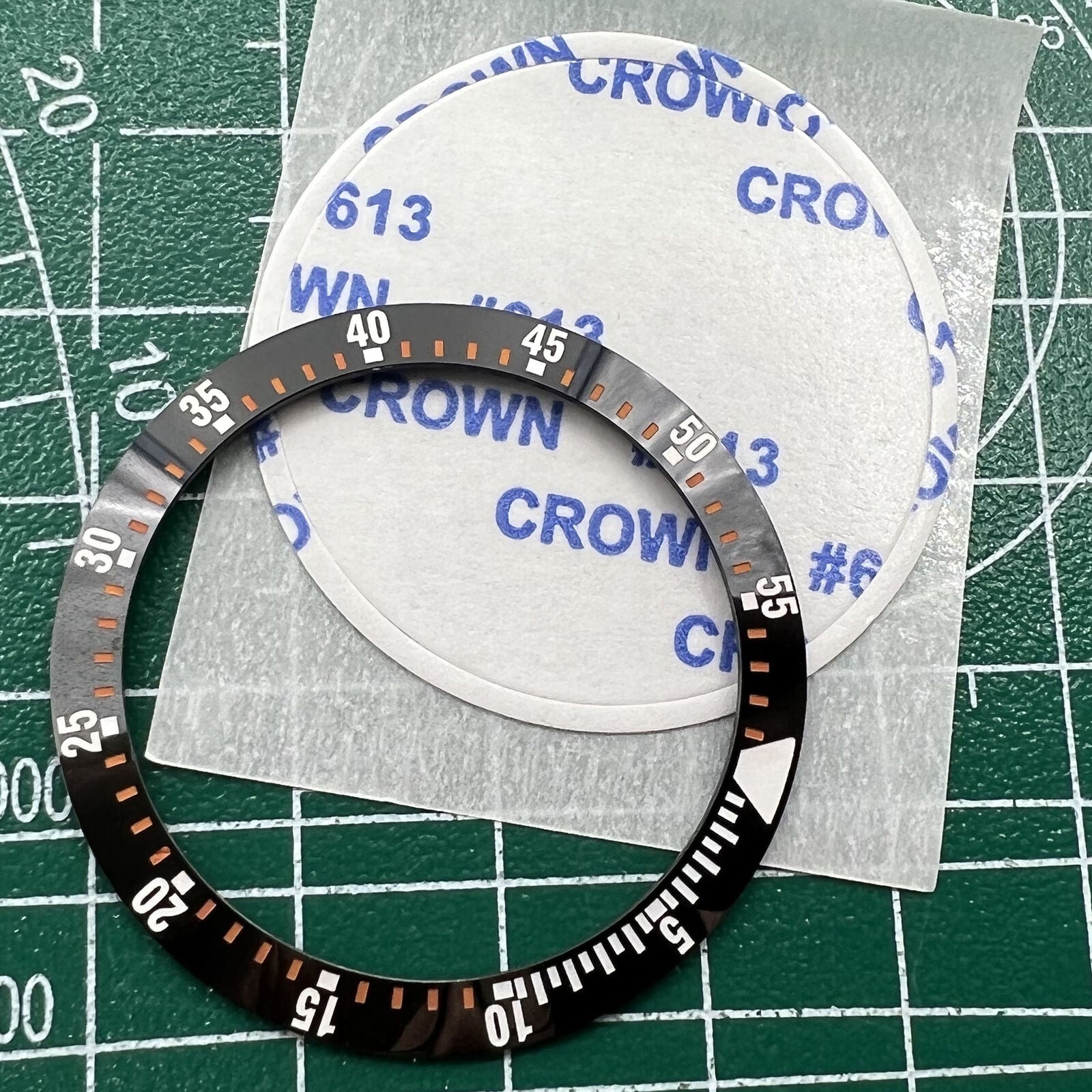 Wholesale black ceramic watch bezel insert with orange graduation, 38mm/30.5mm, ideal for watch repairs and customization.