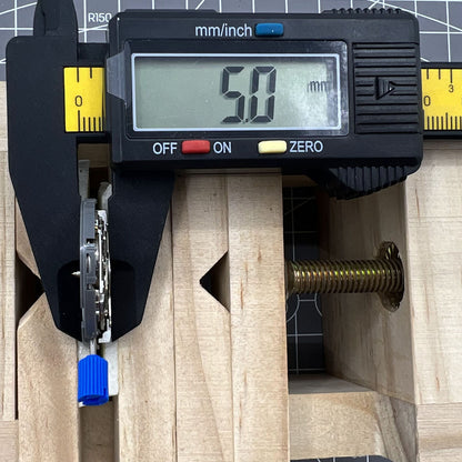 Miyota NH36A black-finished watch movement with green lume and three crown positions for accurate time adjustment.