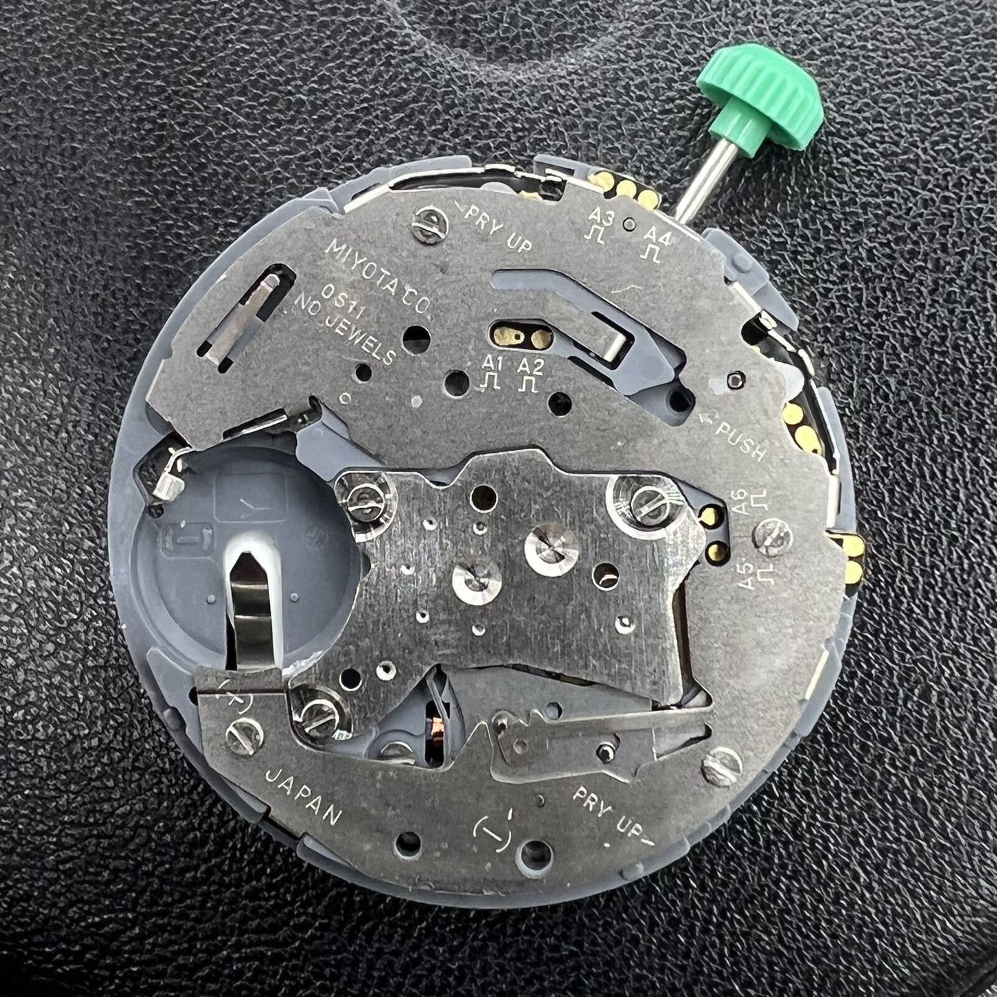 Miyota 0S11 quartz watch movement by Citizen, precise and reliable timekeeping mechanism for watch accessories.