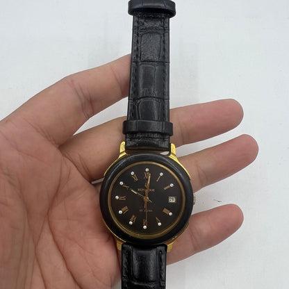 37mm automatic mechanical watch featuring black dial and golden Roman numerals with 33 jewels.