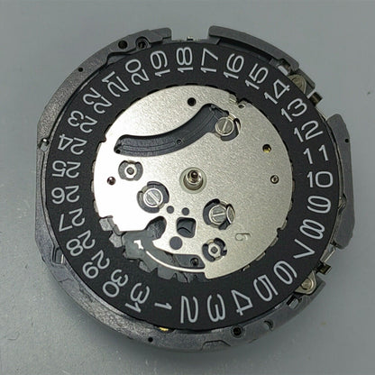 Black disk watch part with Seiko VK63 quartz movement, Japan made, for precise timepiece repair.