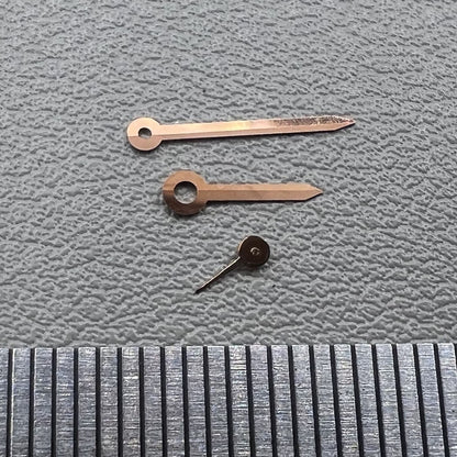 Rose gold arrow-shaped watch hands for Miyota 1L45 movement, stylish trim.