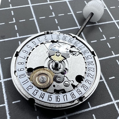 Swiss ETA95614 quartz movement watch mechanism with 2 hands and single calendar date at 6 o'clock, precision timekeeping.
