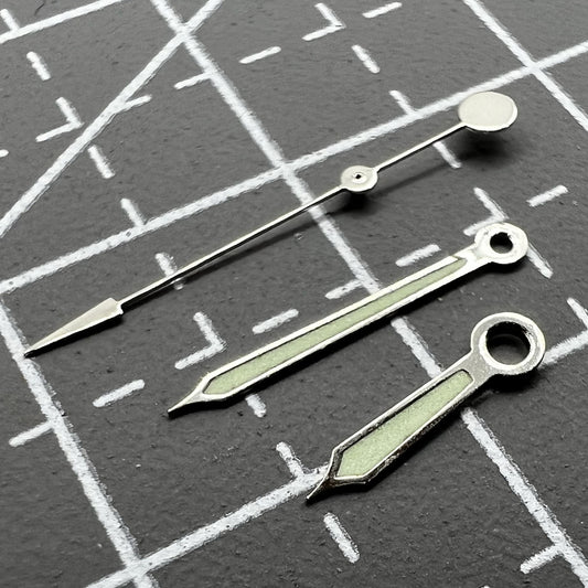Green luminous watch hands with silver trim for Miyota 2035, 2115, 2105, 2305, 2315 movements.