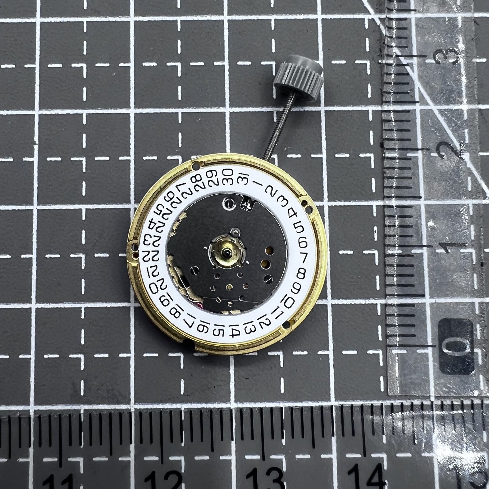 Swiss ETA F04.115 quartz watch movement with 3 hands and date display at 3 o'clock for precision timing.